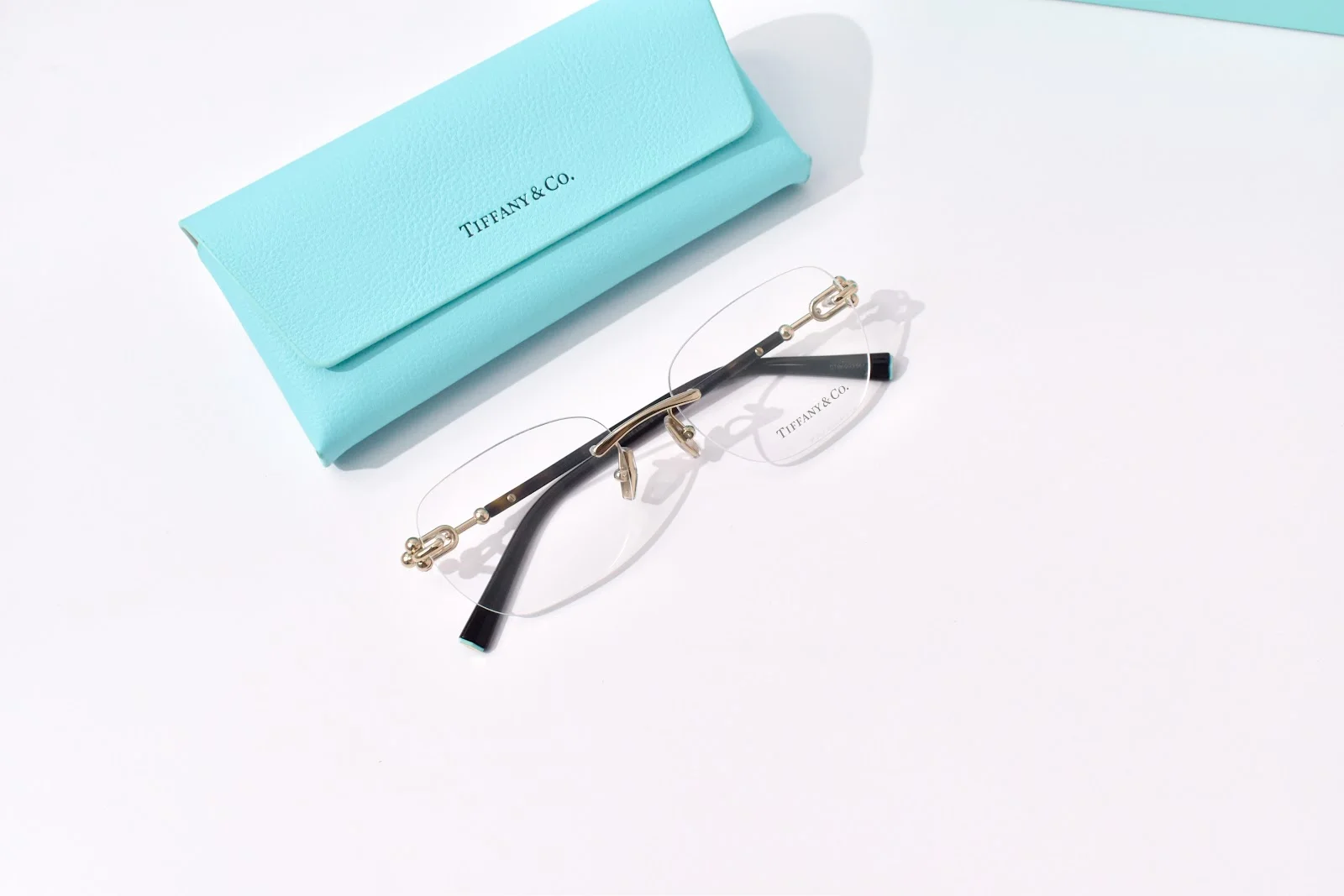 กรอบแว่นสายตาไร้ขอบ Tiffany & Co. TF1170D บานพับโลหะ ขาสีดำ